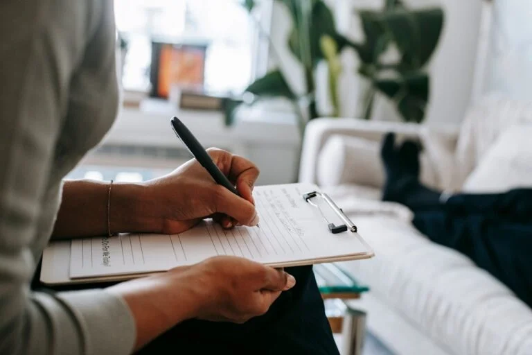 Hand writing on a clipboard