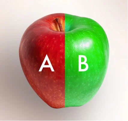 An apple split down the middle, the left half red and labeled A, the right half green and labeled B