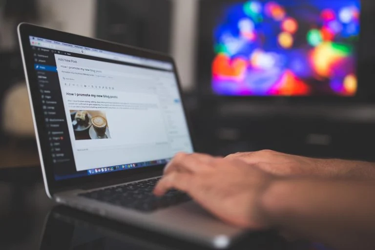 working on a wordpress site on a laptop
