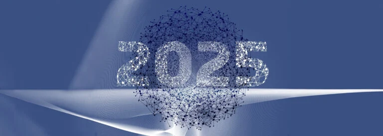 The year 2025 formed from dispersing particles on a blue background