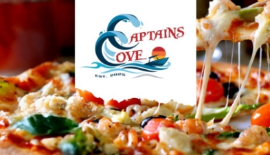 The Captains Cove logo over a close-up of pizza